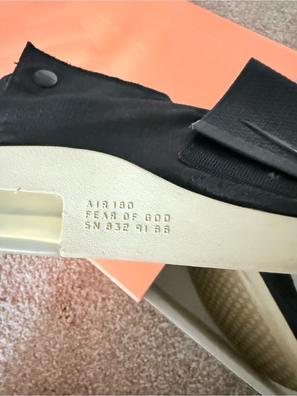 Nike men’s Slip-On Sneaker in Black and Cream